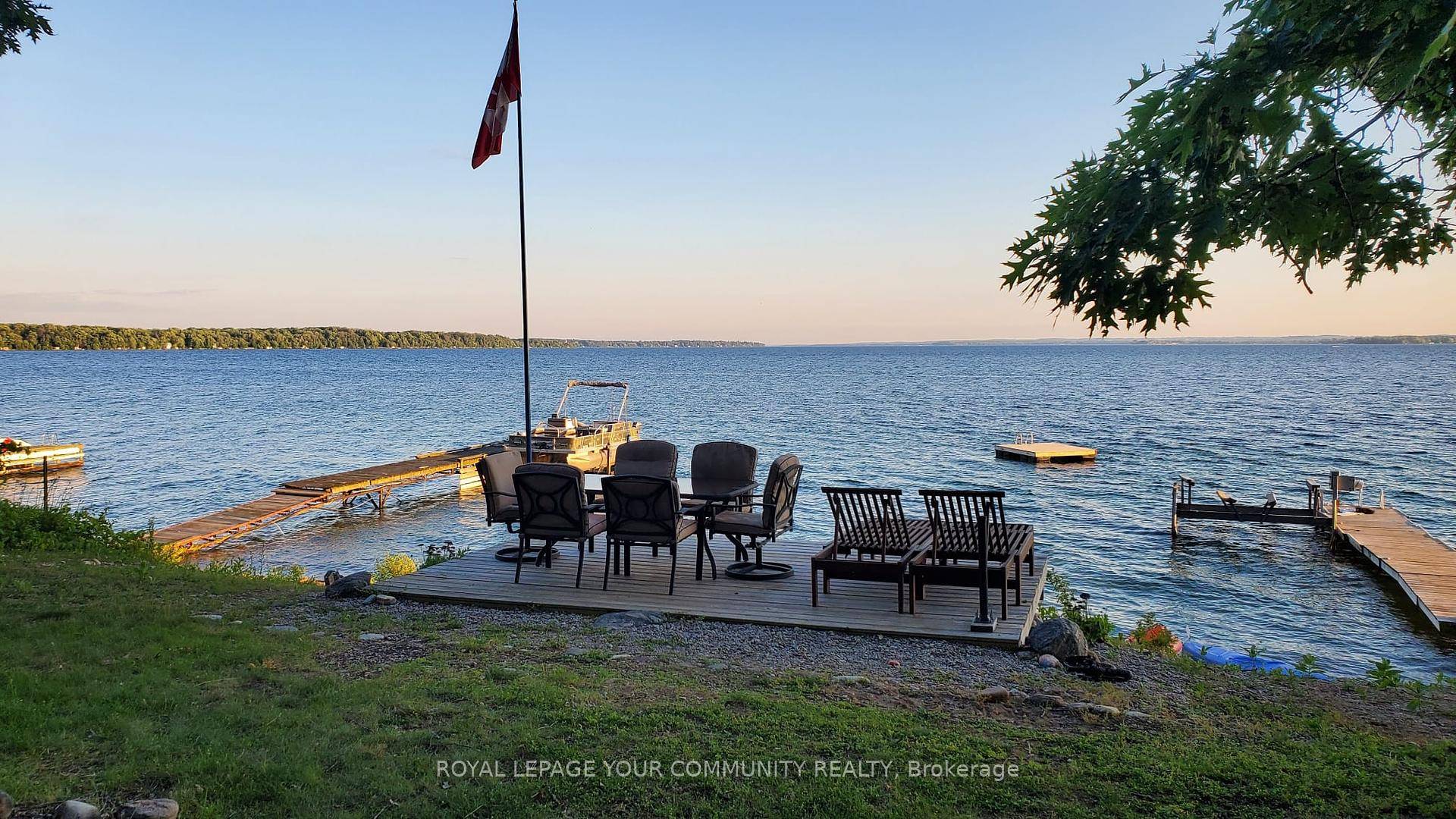 Awesome Lake Simcoe Direct Waterfront Family Cottage on the highly sought after south shore of Fox Island on a Land Lease Lot.