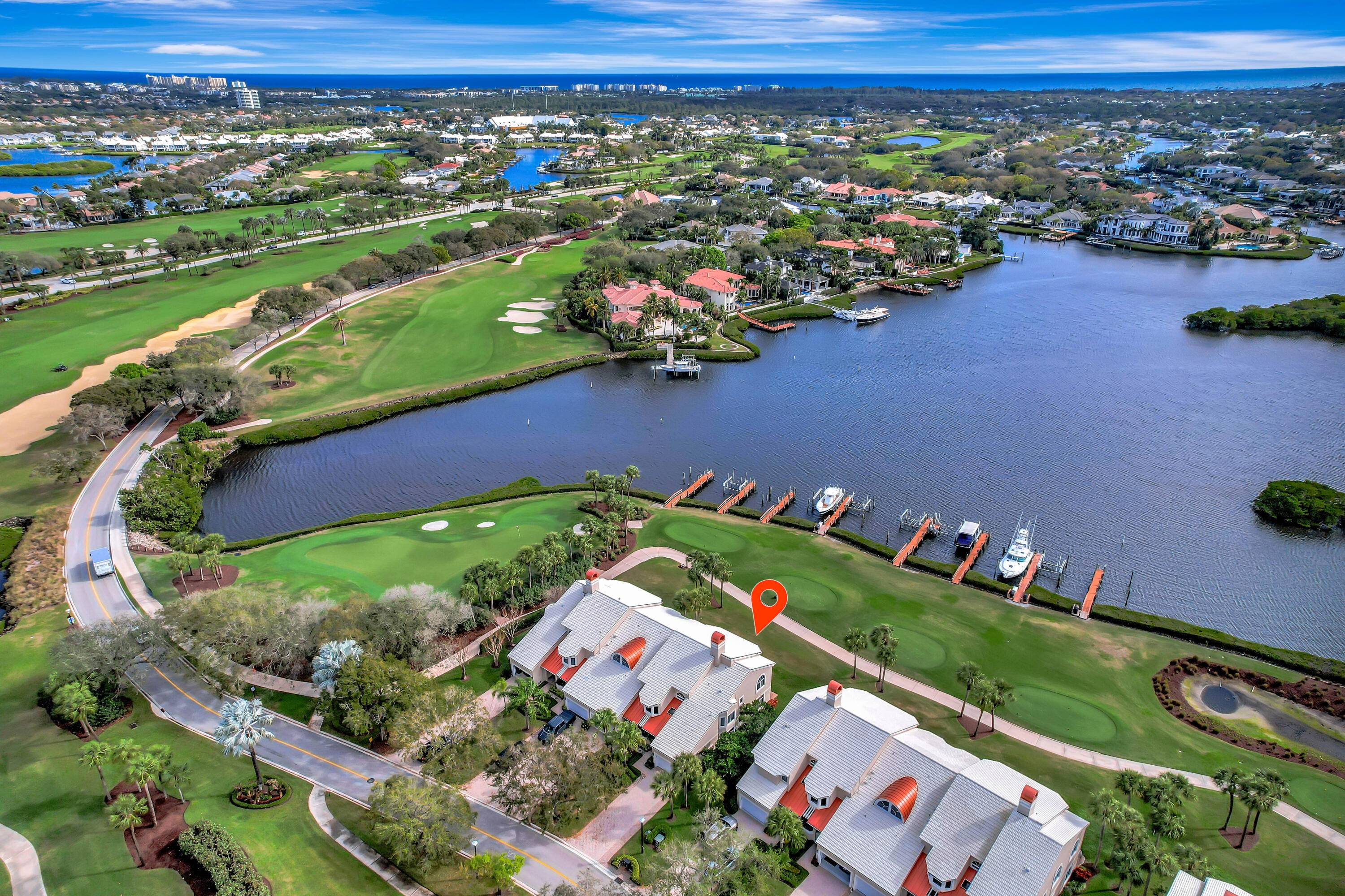 Experience luxury coastal living with unparalleled wide water and golf views !
