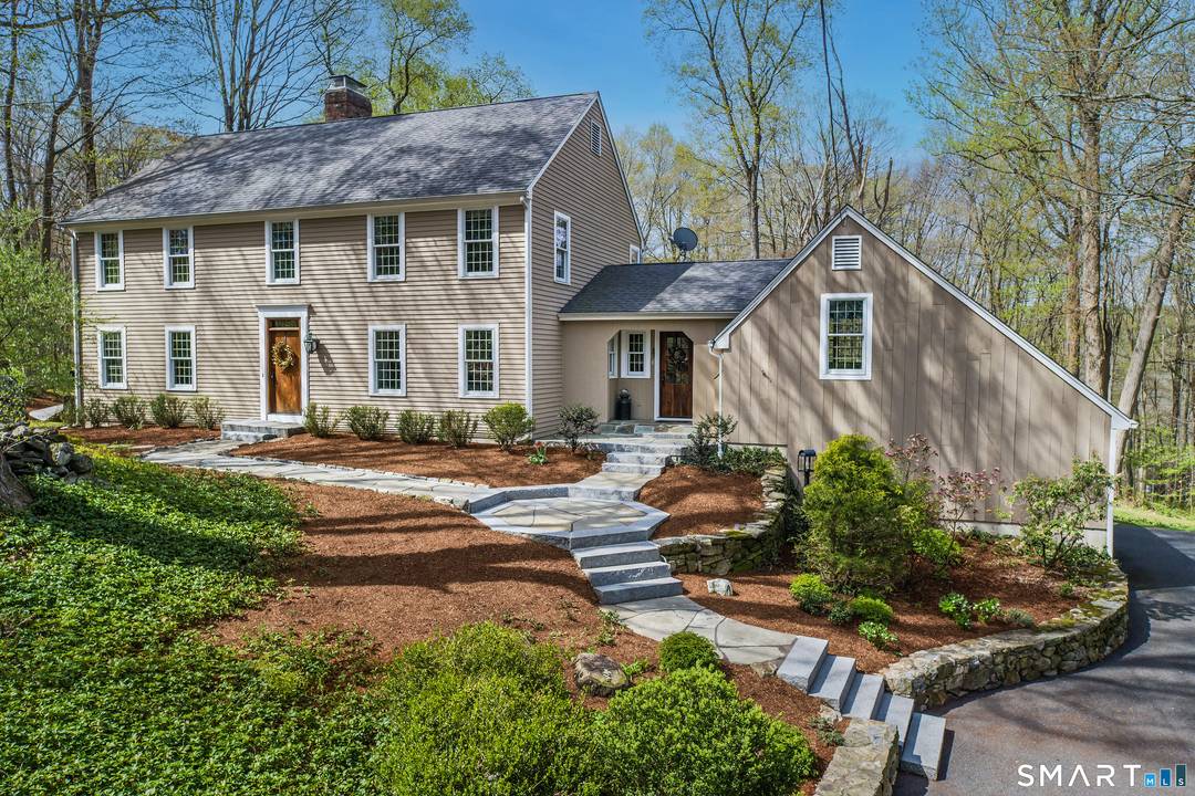 Set on one of South Ridgefield's most desirable cul de sac settings, this classic Connecticut Center Hall Colonial is a timeless residence steeped in charm, character understated sophistication.
