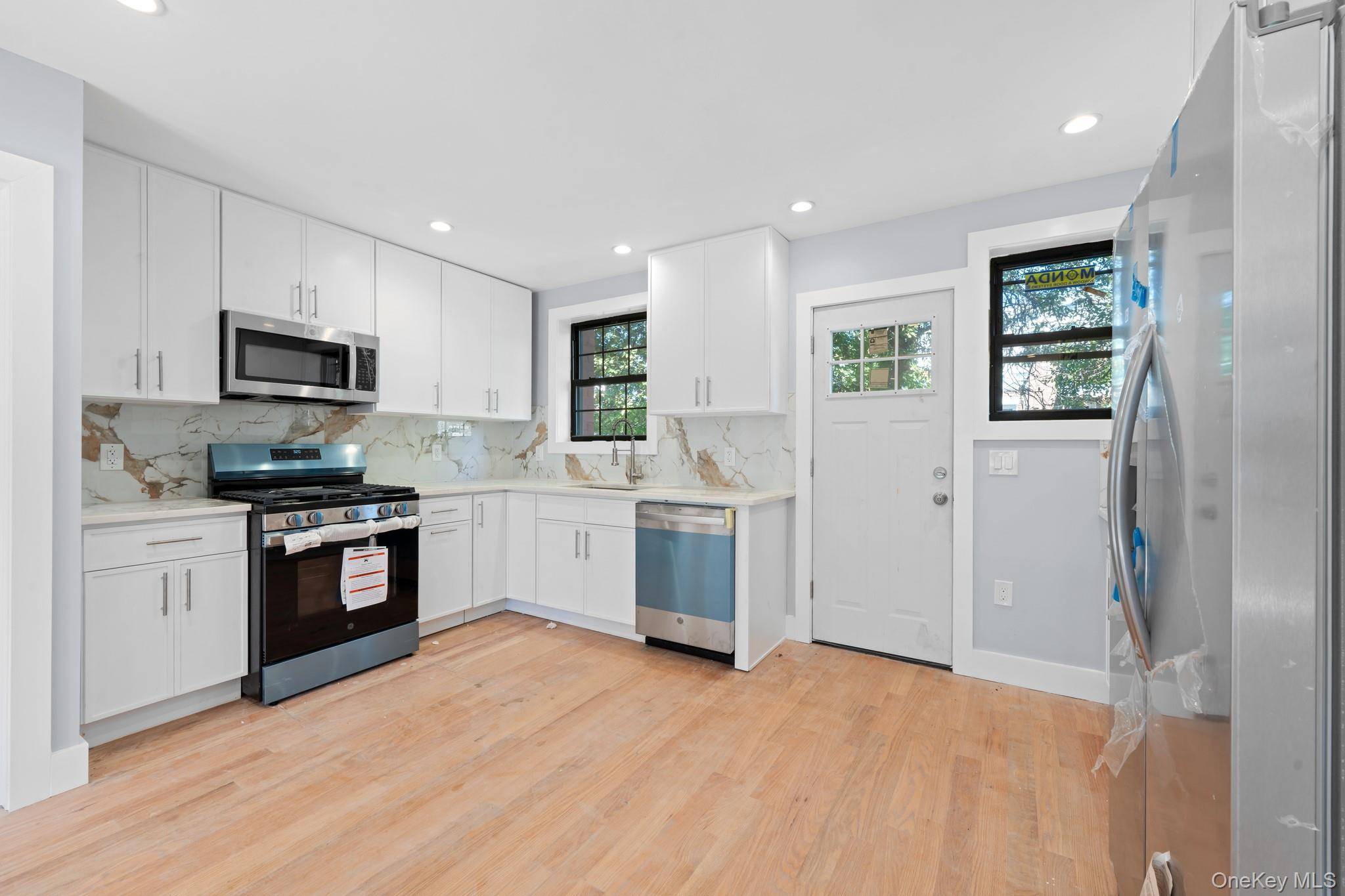 Opportunity Knocks ! Newly renovated, turn key brick 1 family with private parking !