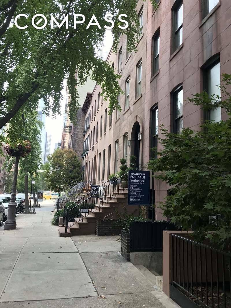 Sutton Place Gem on quiet street with rows of townhouses that feels more like a suburb than city living.
