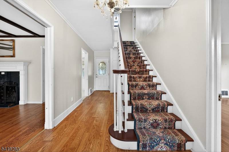 Charming custom Center Hall Colonial set on a generous 75 x 215 corner lot with endless possibilities for those with vision and a passion for gardening and design.