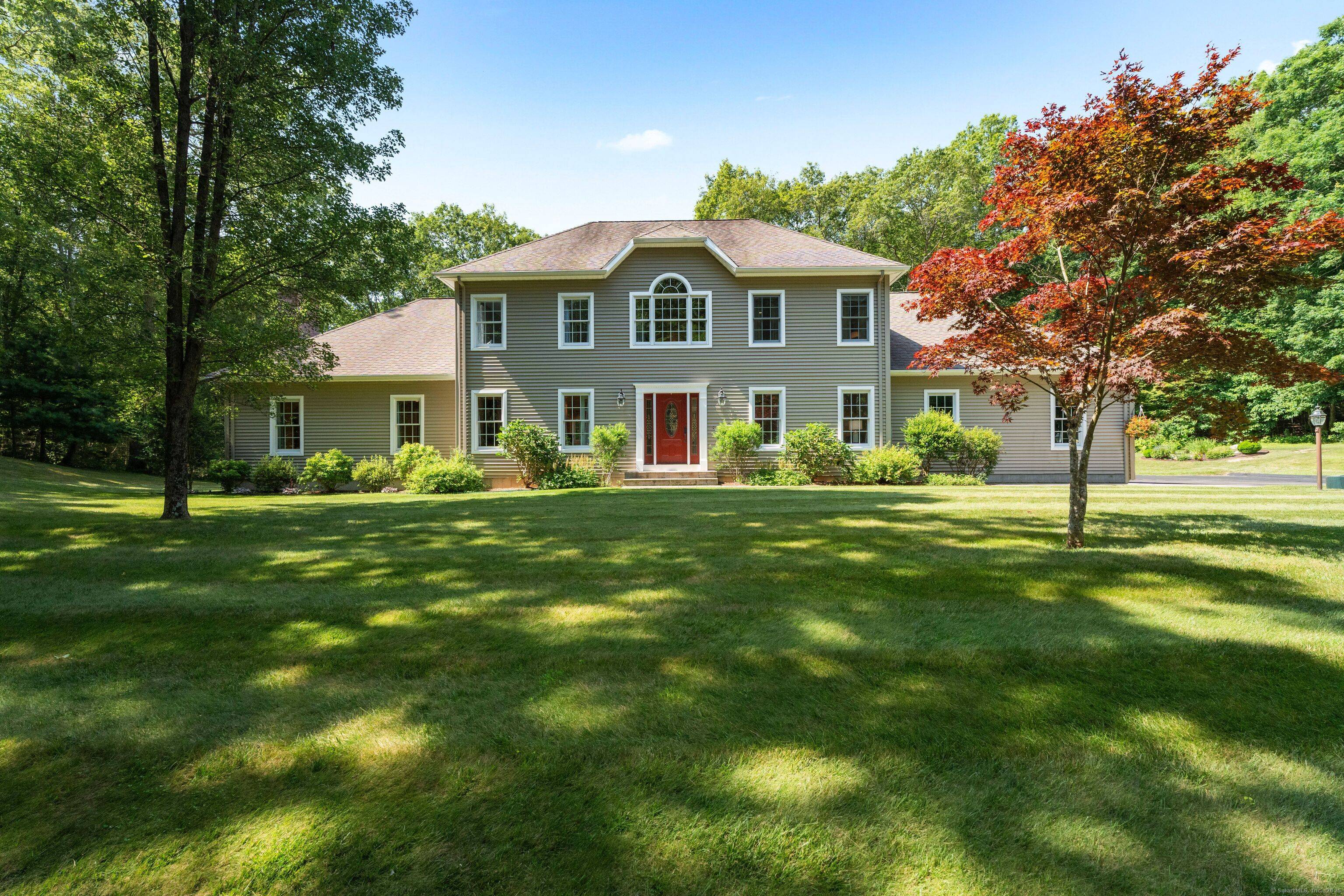 Set back from the road on a beautifully landscaped 2.