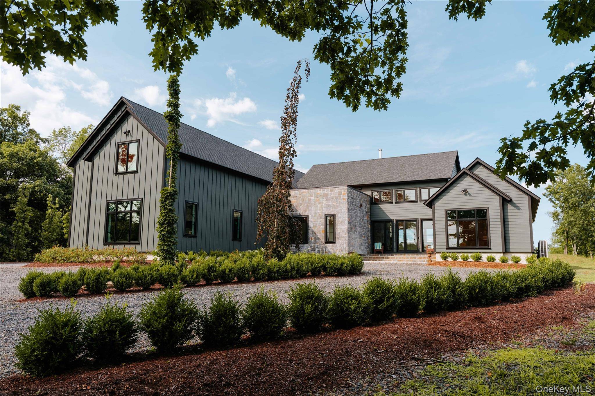 Presenting a freshly constructed modern farmhouse masterpiece set on 13.