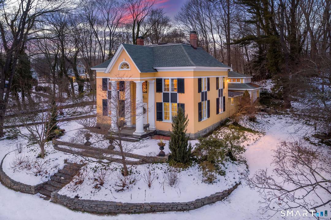 Once known as Hartsbourne, this storied Madison residence is celebrated for its premier location overlooking the town green and its timeless architectural presence.