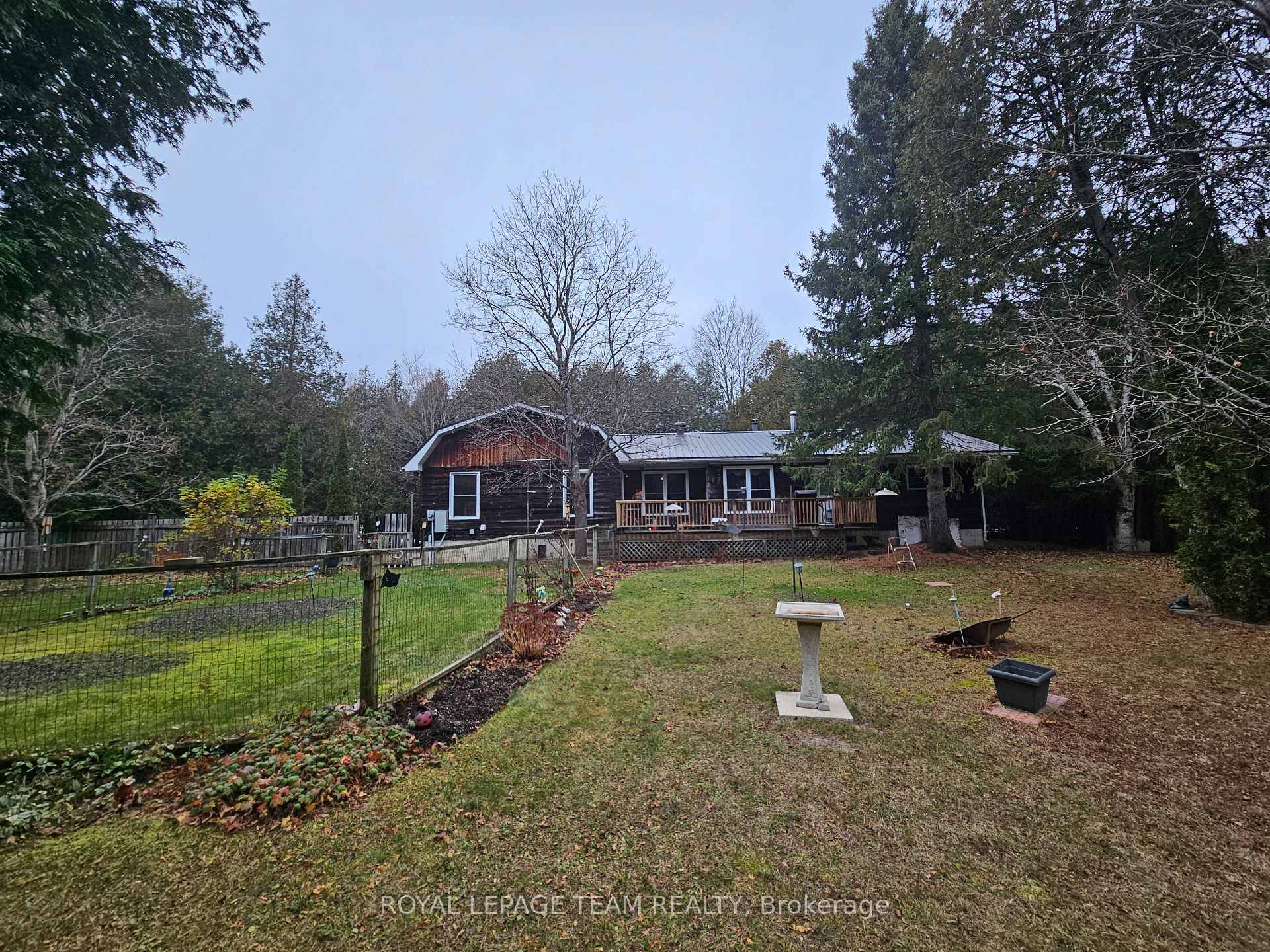 A tranquil 5 acres on a paved road that is truly one of a kind.