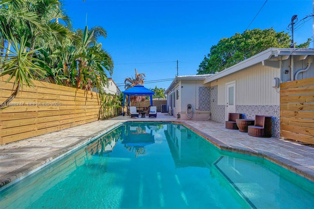 Best corner property in Fort Lauderdale offering exceptional privacy and curb appeal.