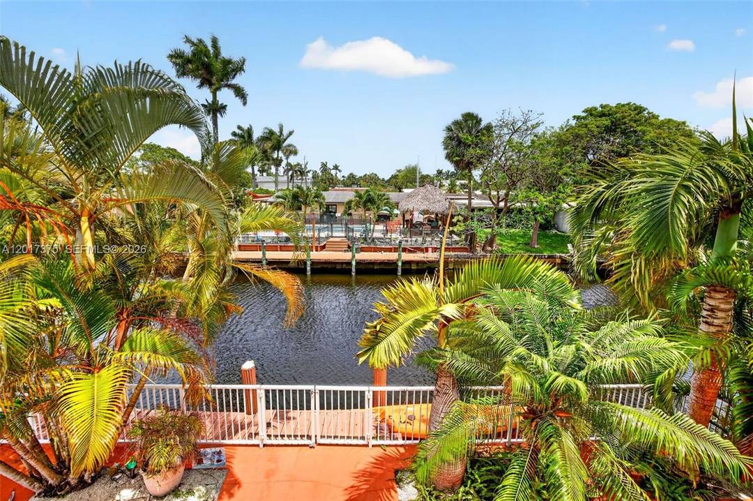 70 FT ON WATER NO HOA ! Waterfront living w architectural character in this spacious 2 story MID CENTURY MODERN deepwater home in Lauderdale Isles.