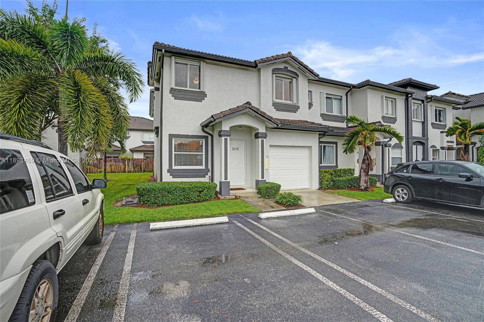 Discover this beautifully maintained corner townhome featuring 3 bedrooms and 2.