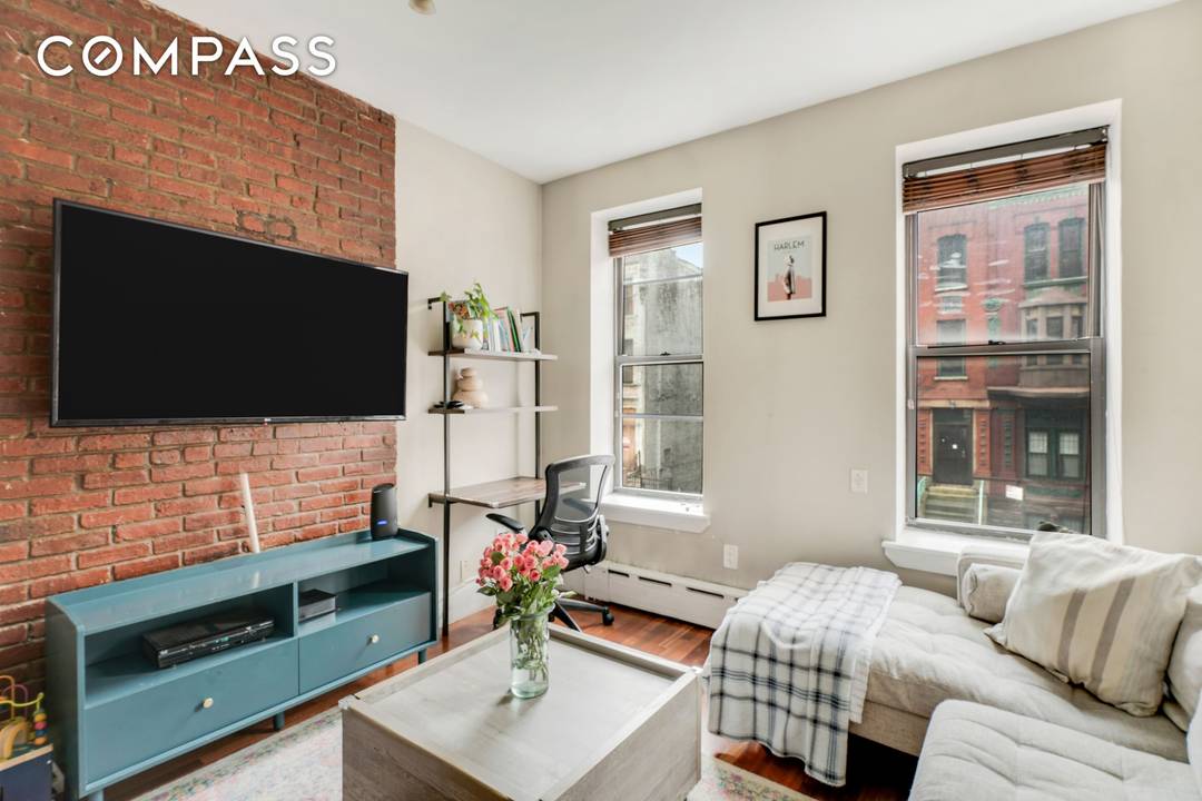 Located just one flight up, this bright two bedroom home blends circa 1910 architecture with abundant natural light, featuring twelve windows that fill the space throughout the day.