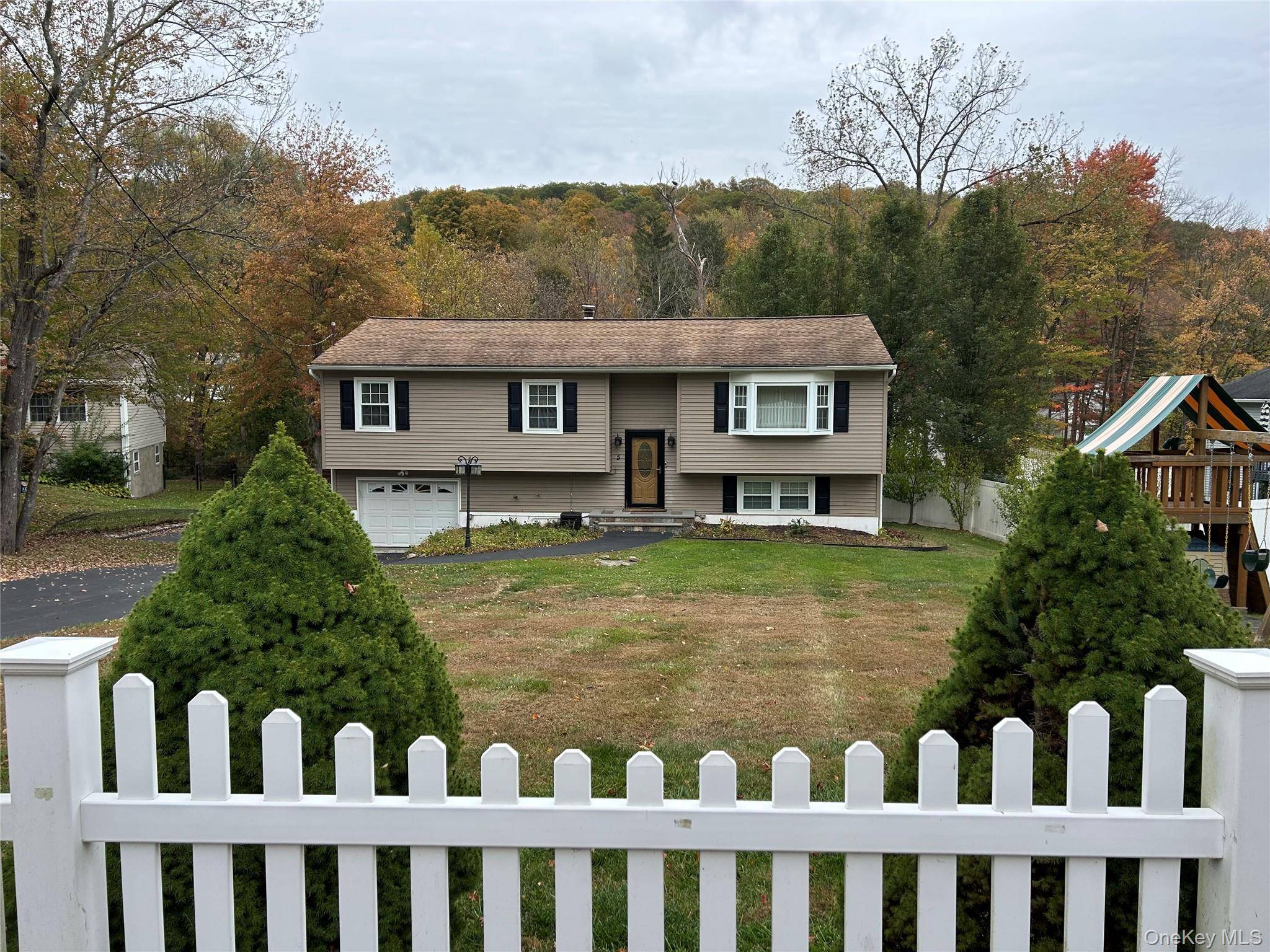 This beautifully maintained Raised Ranch home offers warmth, space, and functionality in a peaceful residential setting.