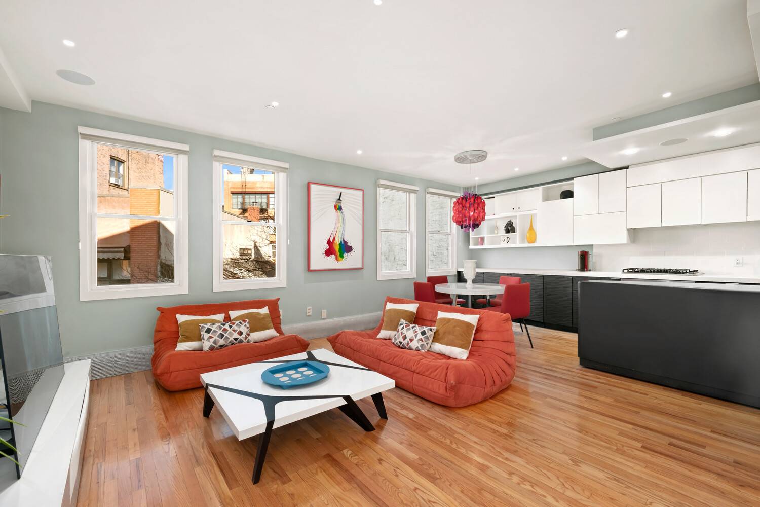 This stunning loft like triplex offers an unusually private and sun filled living experience in the heart of the East Village.