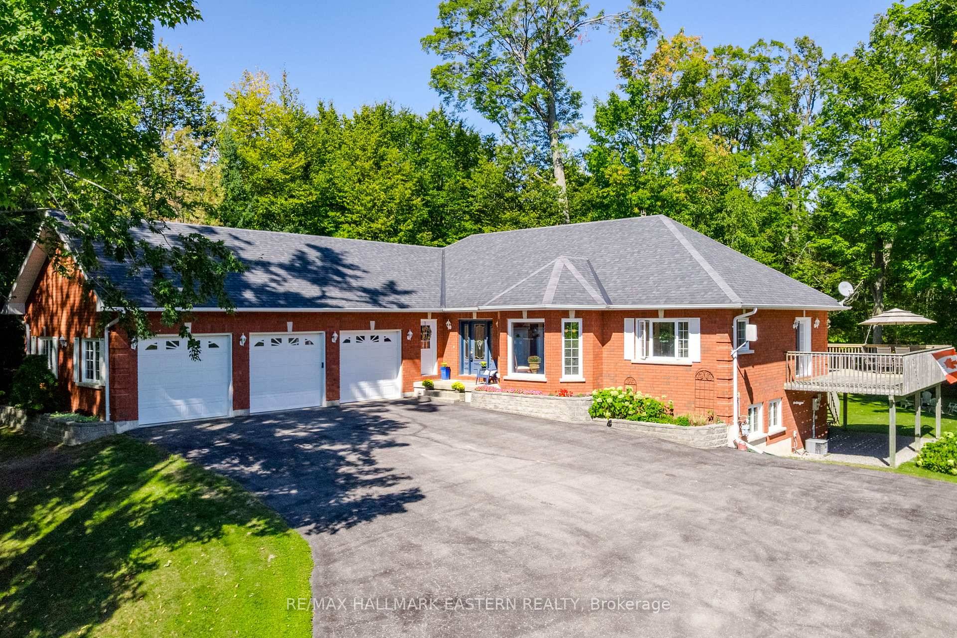 Welcome to this custom built, all brick executive bungalow, offering nearly 4, 000 sq ft of impeccably designed living space on a breathtaking treed and landscaped property.
