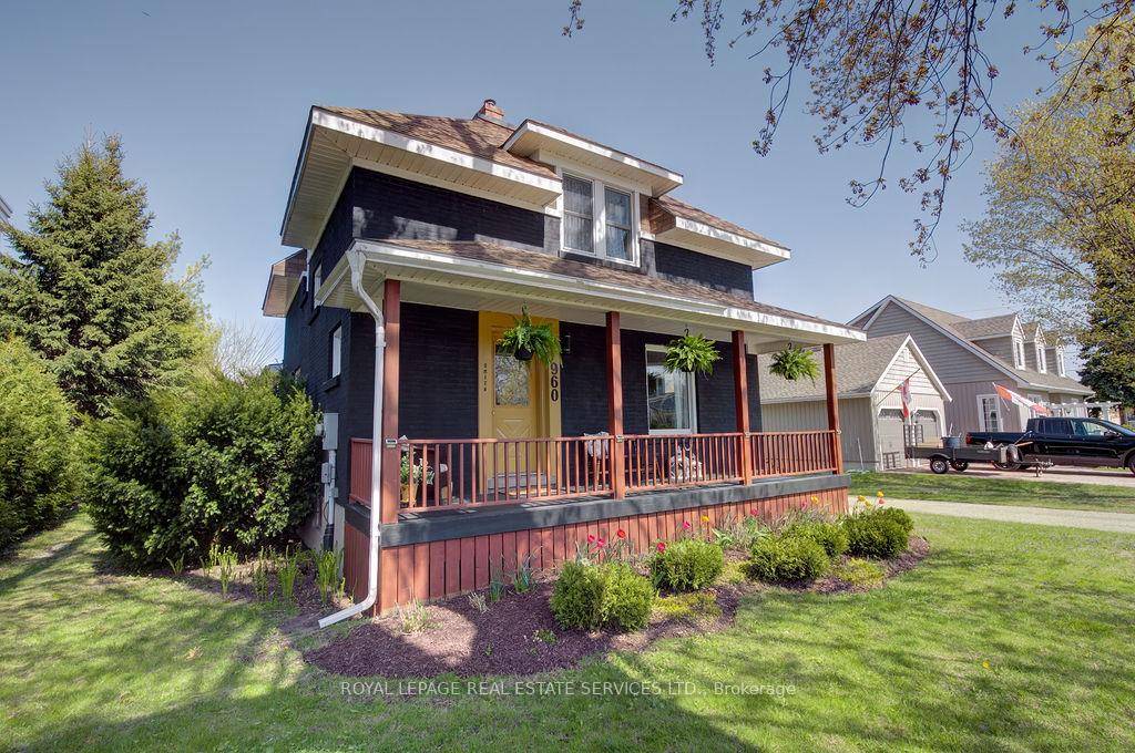 0ld fashioned charm is beautifully married with a modern aesthetic to give this home great curb appeal and invite you in with its welcoming front porch.