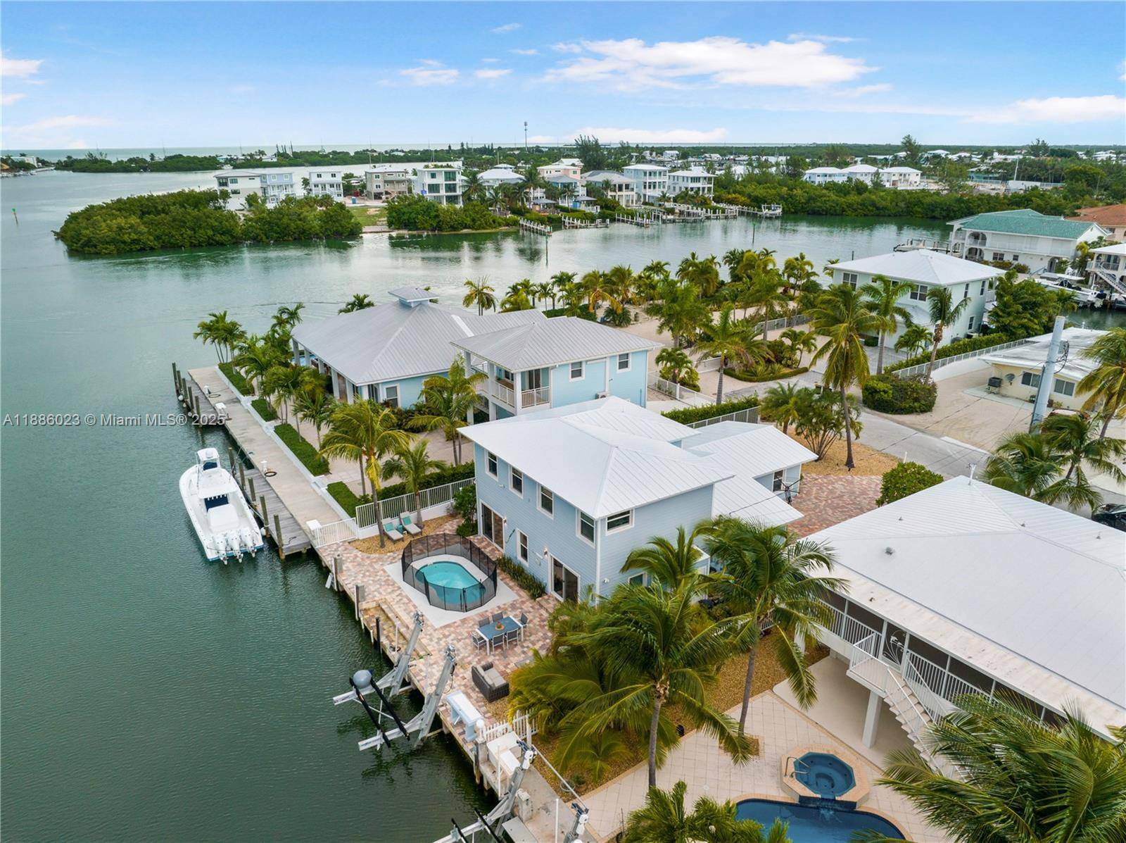 This Key Colony Beach coastal retreat blends modern elegance with waterfront tranquility is steps from Bonefish Bay.