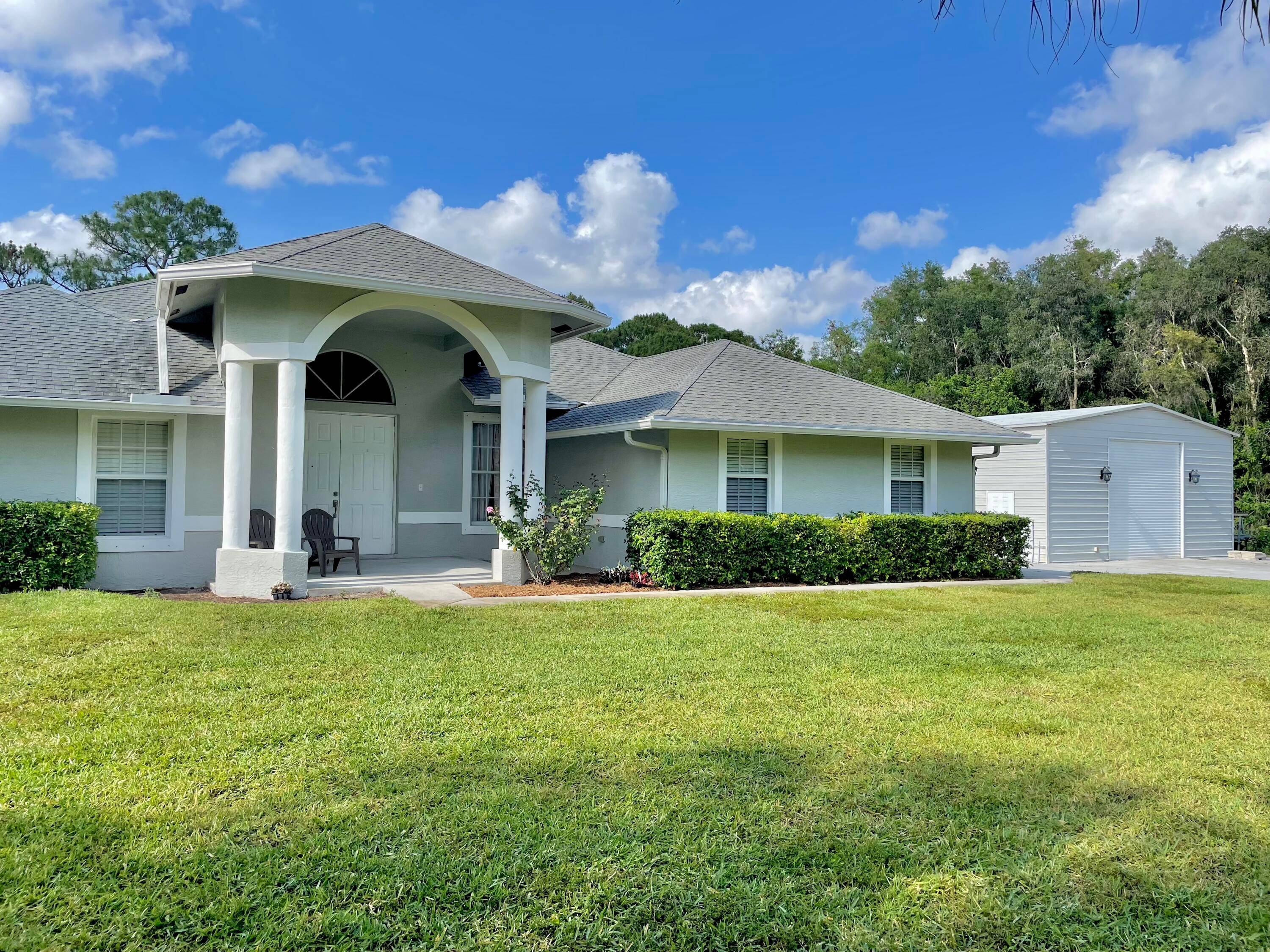 PAVED ROAD COMING SOON ! Built for family living weekend fun, this light, airy home sits on 1.