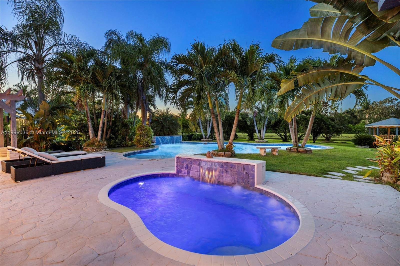 Discover refined living on a full acre in Kapok Village Estates, one of Davie s most coveted communities.