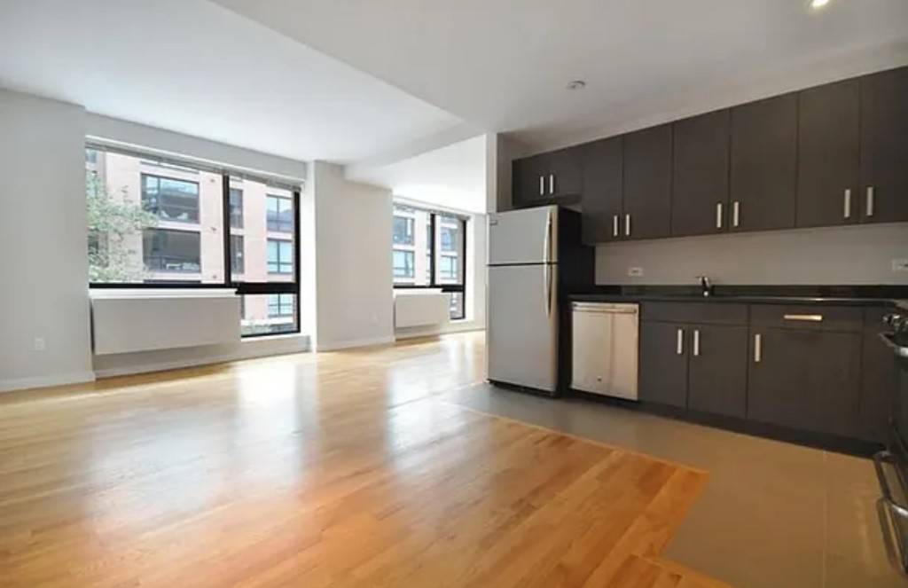 This massive three bedroom two and 1 2 bathroom home features an in unit washer dryer, oak plank flooring, double pane windows, stainless appliances and custom cabinetry.