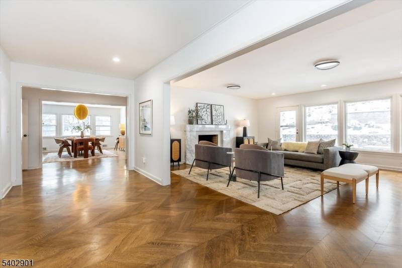 Nestled on nearly three quarters of an acre in a coveted South Orange enclave, this gracious 4BR, 3.