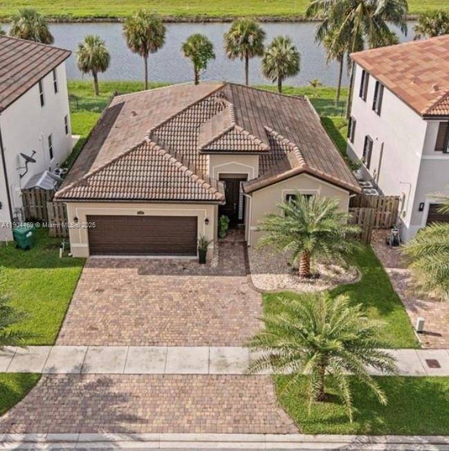 Stunning 3 2 single family home perfectly situated on a serene lake !