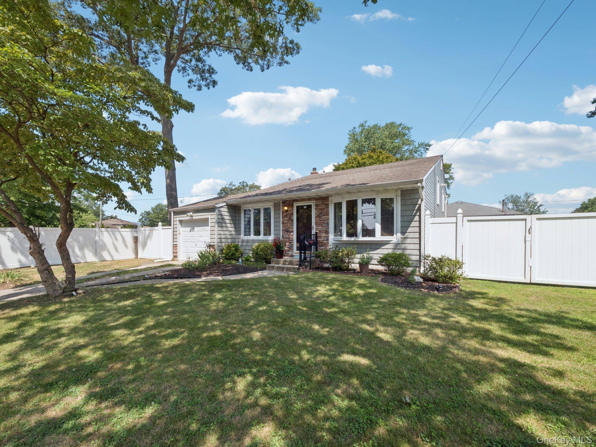 Welcome home to 247 Woods Road, ideally situated between Woods Road and Nolting Avenue.
