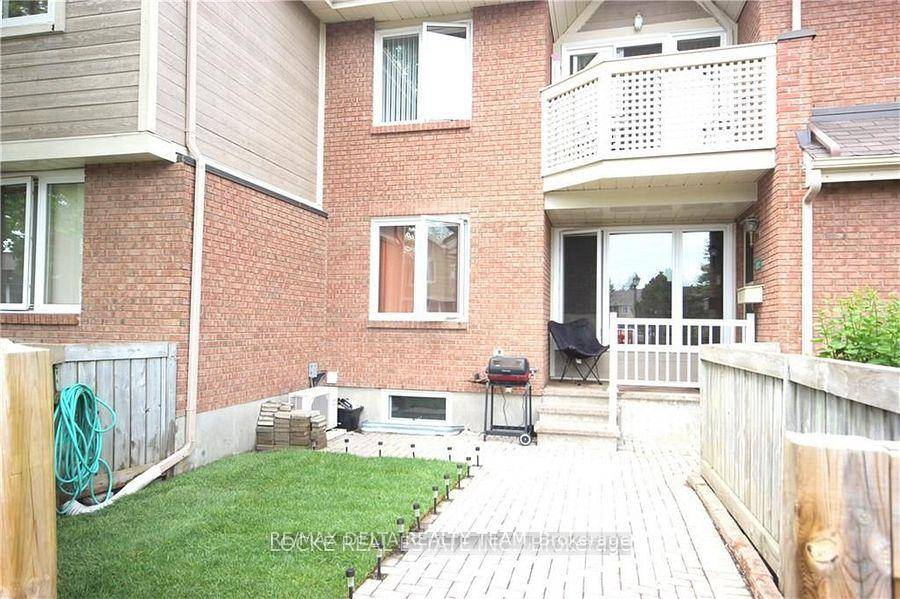 Convenient and spacious one level bungalow style condo with yard and finished basement just steps from shopping and amenities.