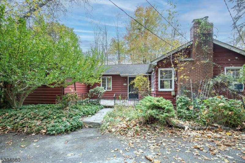 Charming private setting surrounds this one level home.