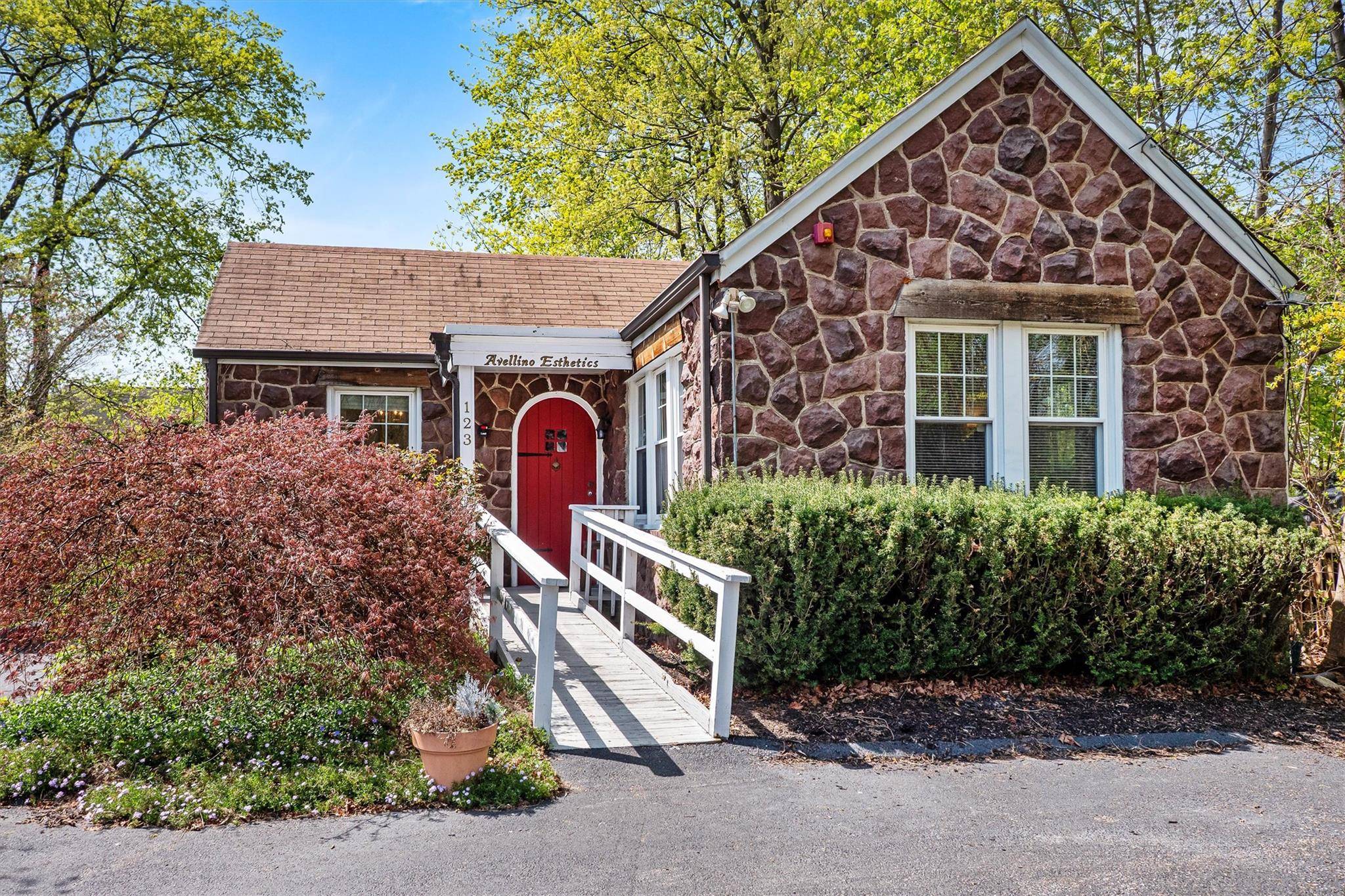 A MUST SEE COMMERCIAL picture perfect sand stone cottage investment opportunity.