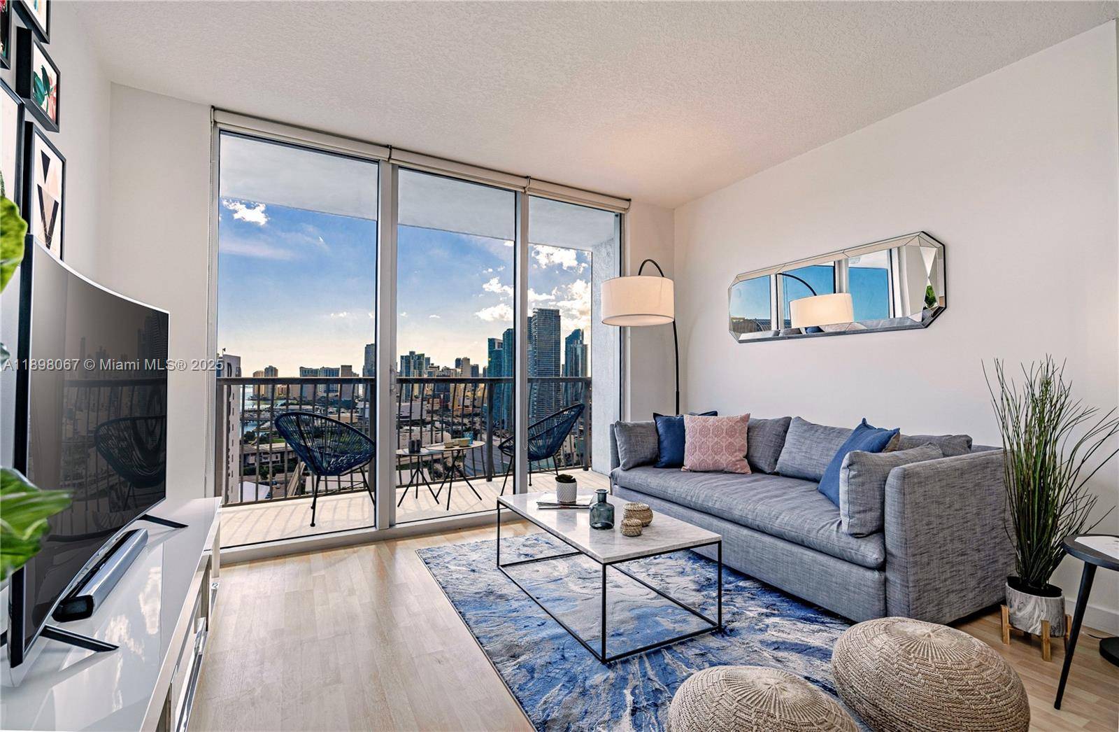 Spectacular panoramic views from every angle in this gorgeous turnkey residence at Opera Tower, one of Edgewater s most iconic waterfront high rises.