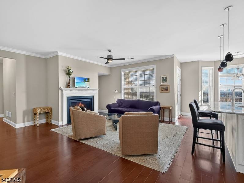 Experience elegant one floor living in this highly sought after Iris II model w NYC skyline views, ideally situated on the 1st floor of a prestigious gated 55 community.