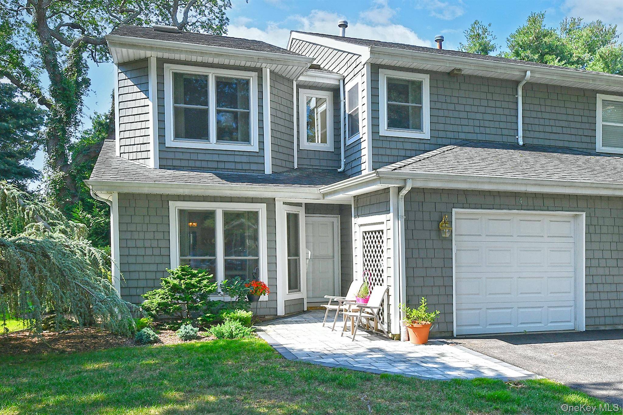 Welcome to 4 Madder Lake Circle, centrally located in the private, gated community of Indian Head Forest situated within the Commack School District.