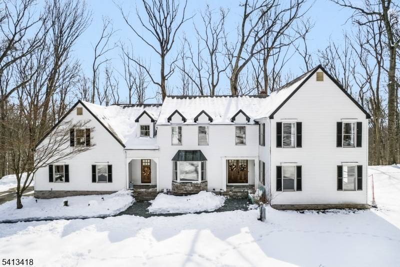 Welcome to this beautifully reimagined 4, 437 square foot Colonial, privately nestled on 4.