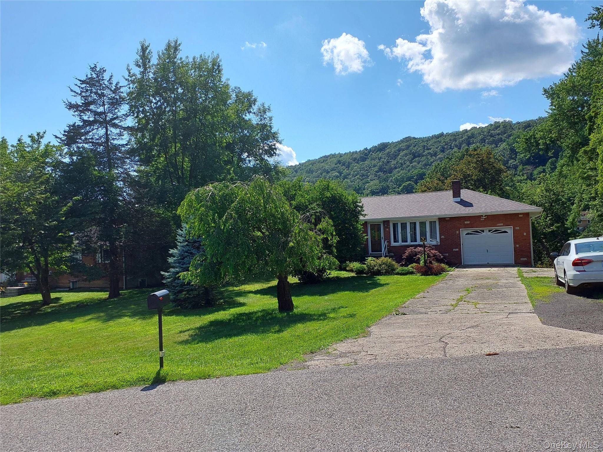 Welcome to 1 Tappan Drive, a charming lakefront home nestled in the Village of South Blooming Grove.