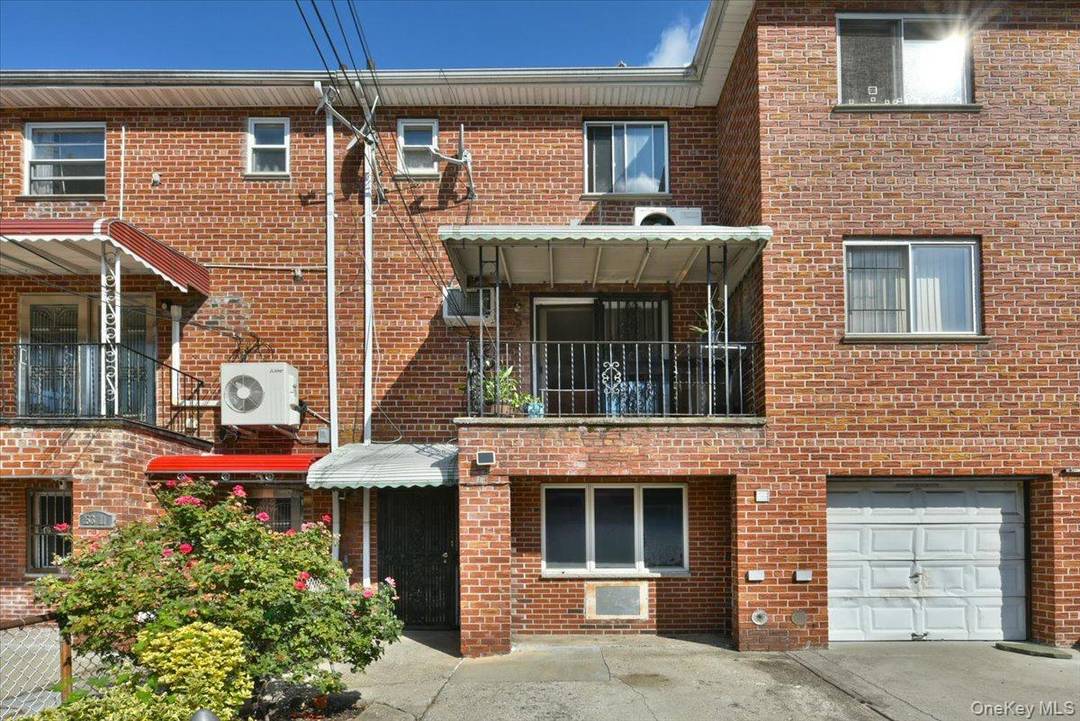 Welcome to this legal two family attached townhouse style home located in the heart of Kew Garden Hills.