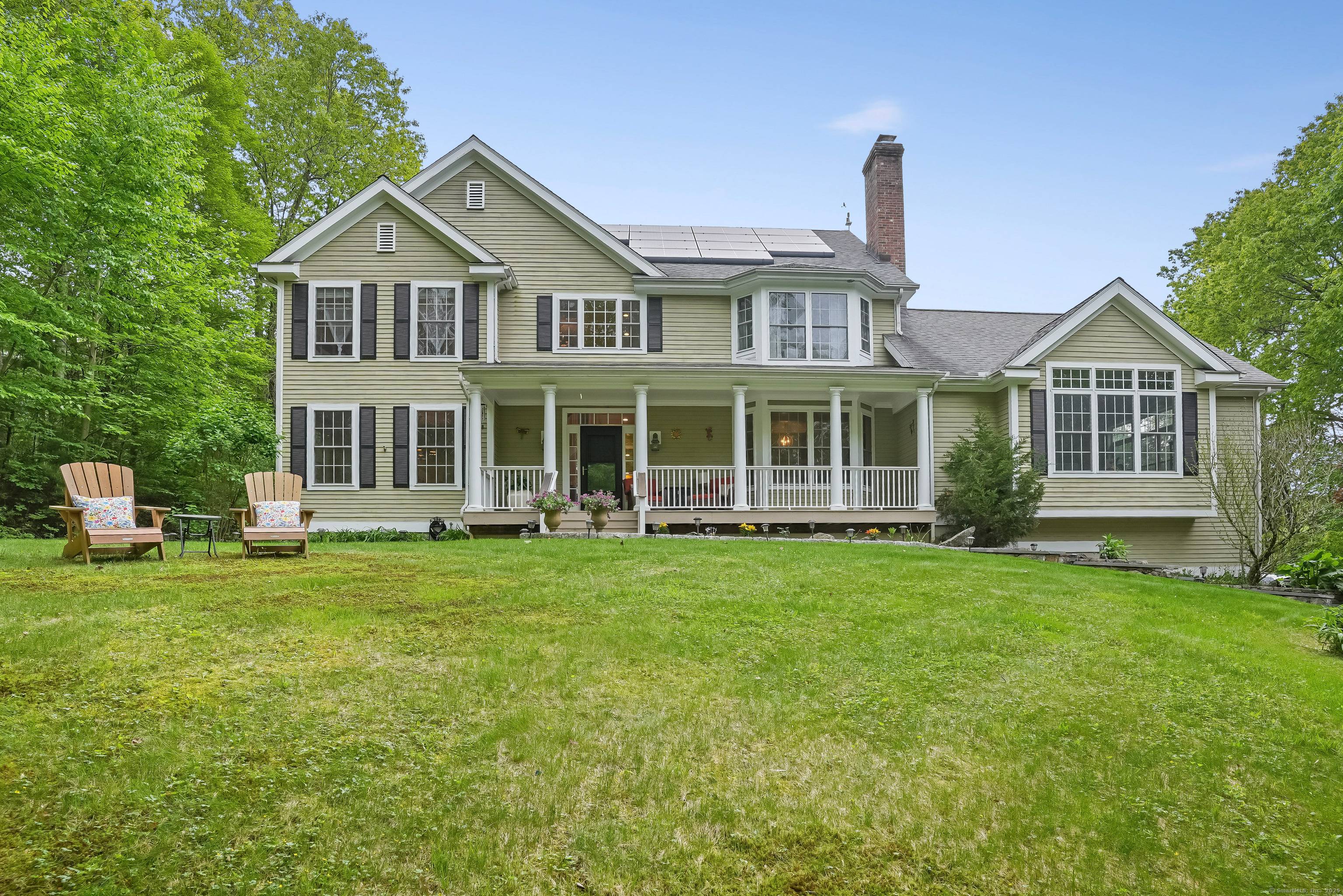 Tucked away on a quiet country road, this exquisite newer Colonial offers the perfect blend of seclusion and convenience just minutes from the heart of Newtown.