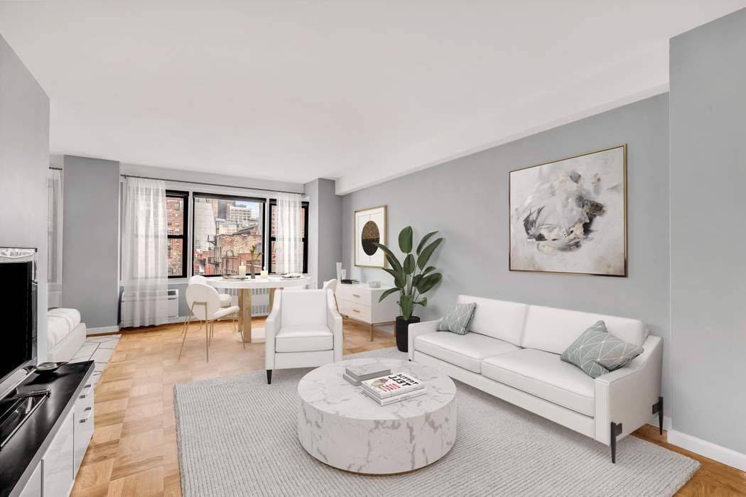 Sunny open views abound in this spacious alcove studio in a full service building !