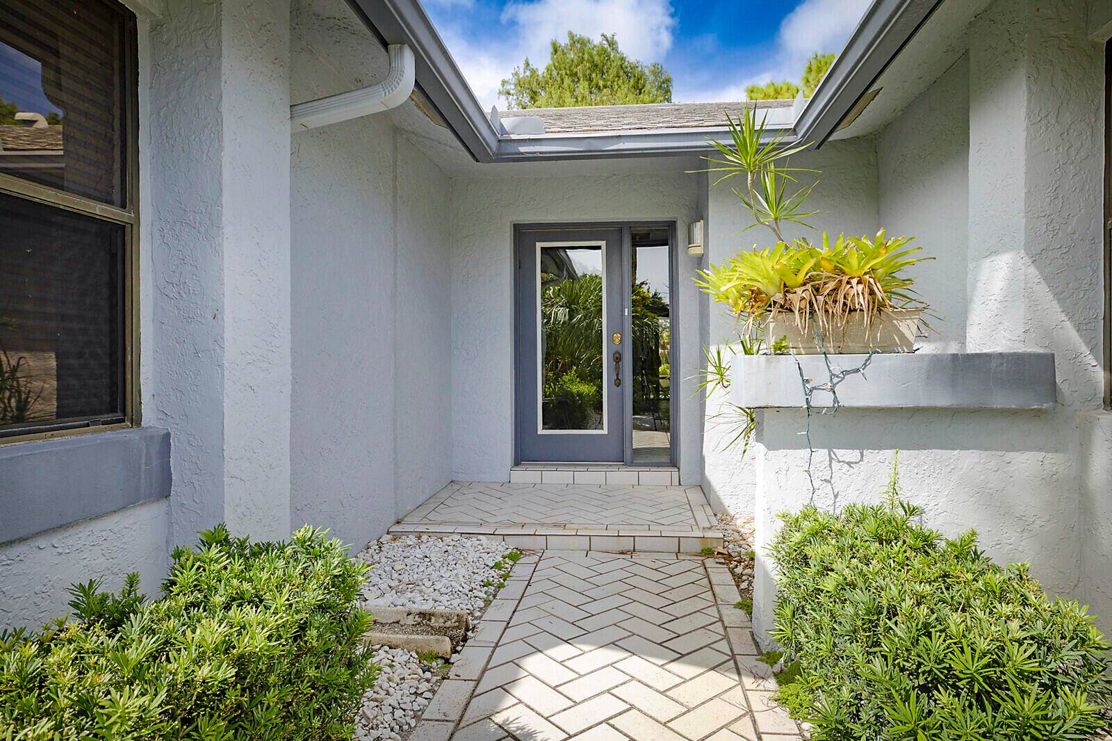 Fantastic 2 bedroom, 2 bathroom home with 2 car garage and a double lanai one with a glass enclosure for an oversized Florida room and the other is a screened ...