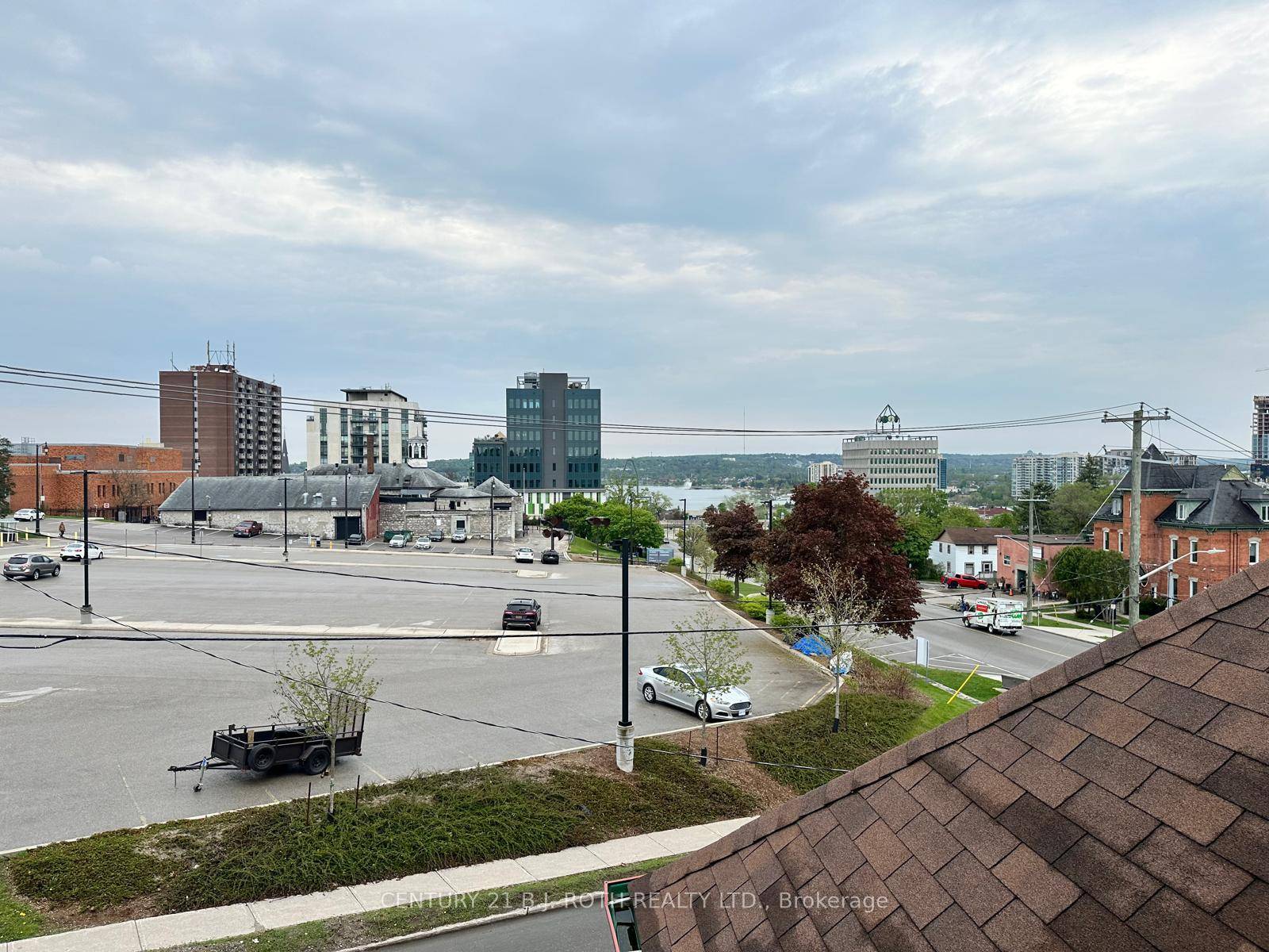 6 self contained apartments in this charming income property on a bus route with a view from the porch and some of the units to Barrie's beautiful waterfront.