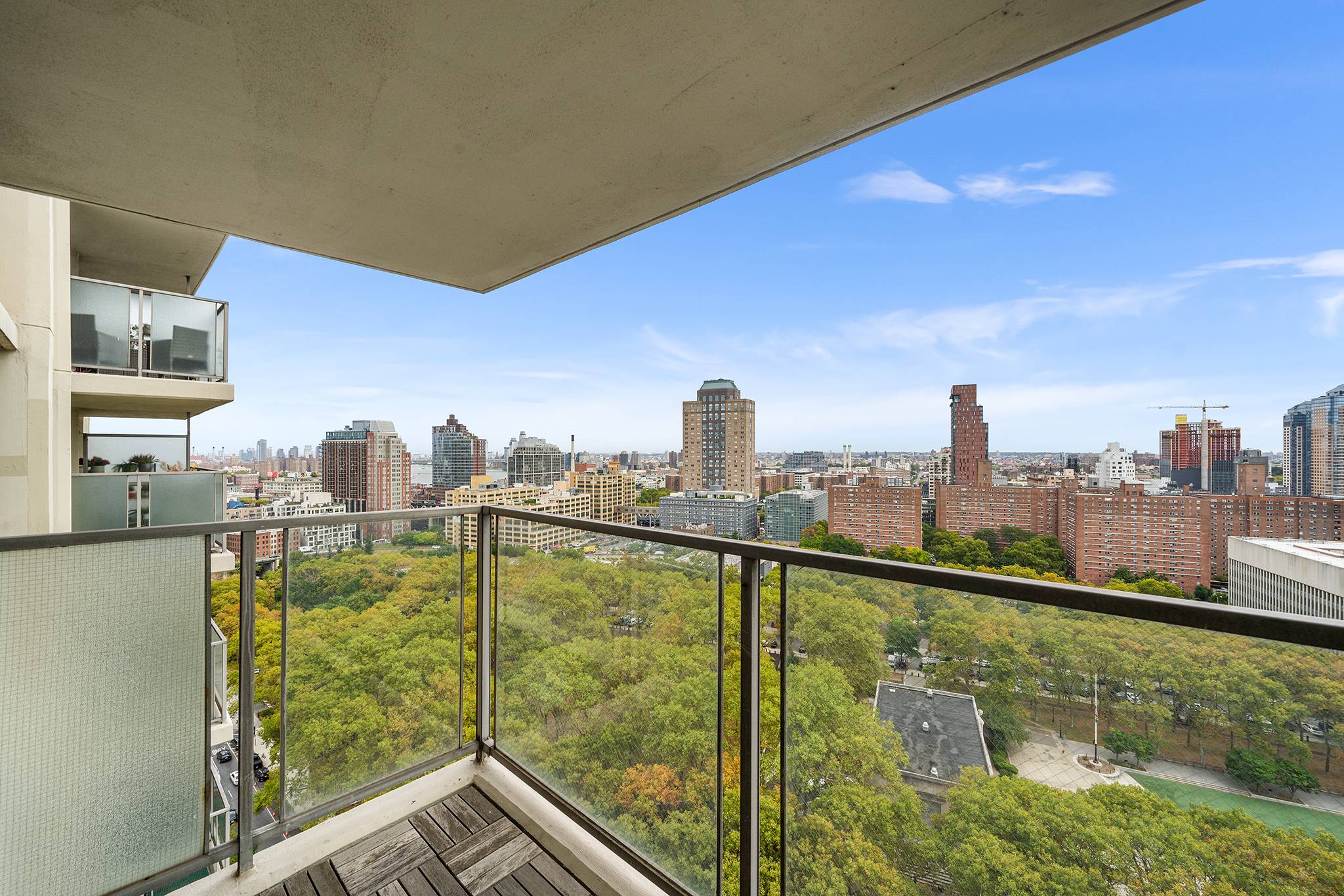 Perched high above the storied streets of Brooklyn Heights, apartment 21G at 75 Henry offers a captivating tableau of urban beauty.