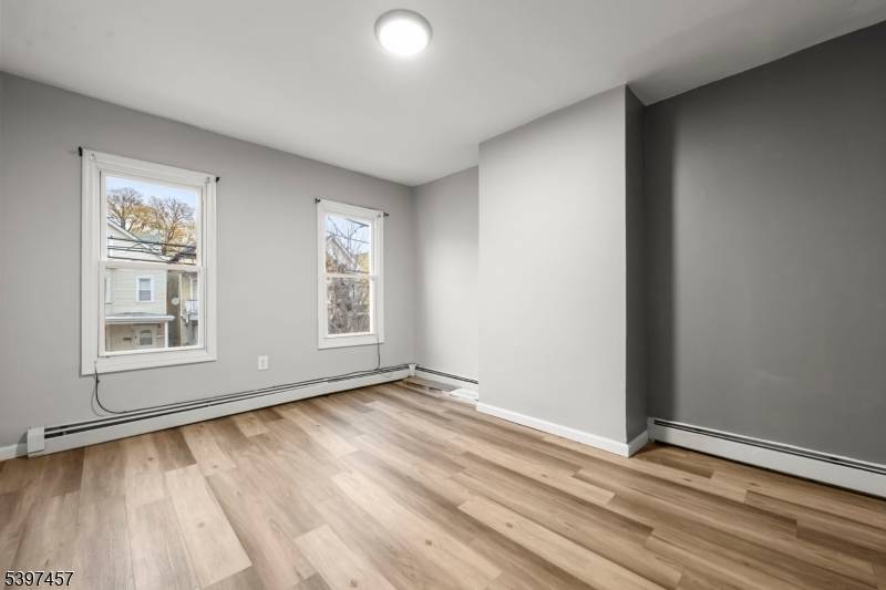 This beautifully renovated 3 family home features two spacious units, each thoughtfully designed with a living room, dining room, two bedrooms, and a large, kitchen perfect for gatherings and entertaining.