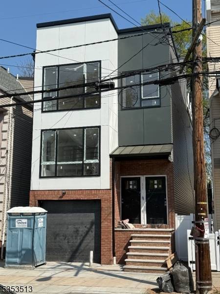 Welcome to this stunning, brand new construction 2 family home that perfectly blends modern luxury with thoughtful functionality.
