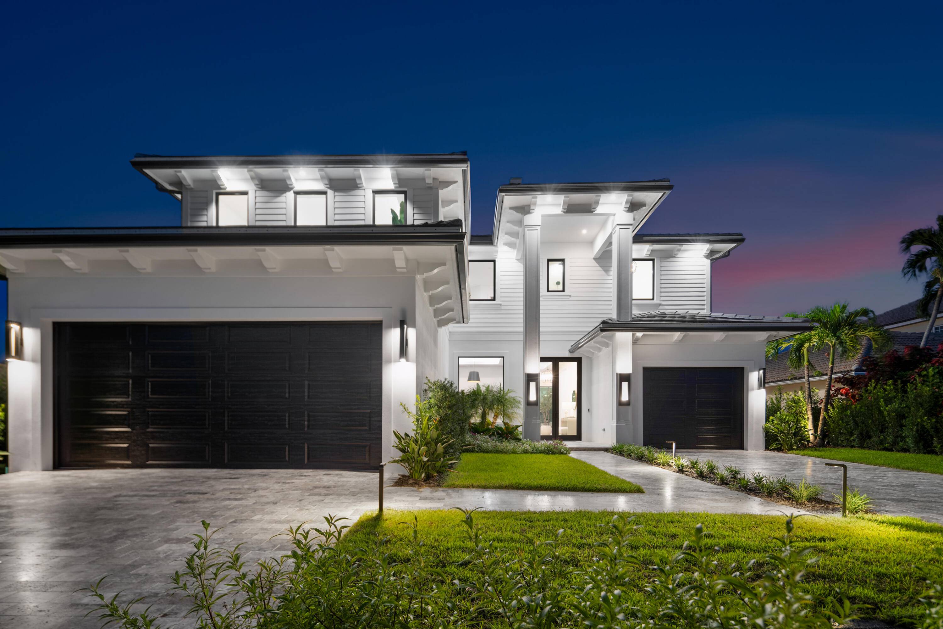 Waterfront luxury meets modern design in this fully furnished new construction masterpiece.