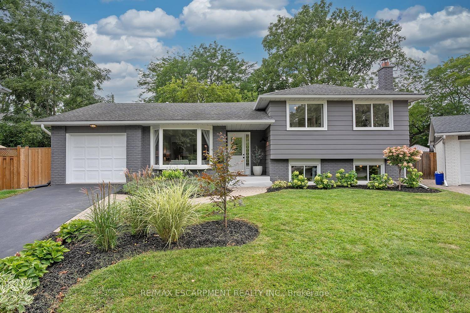 This stunning 4 level side split sits on a private pie shaped lot on a quiet crescent in Roseland.