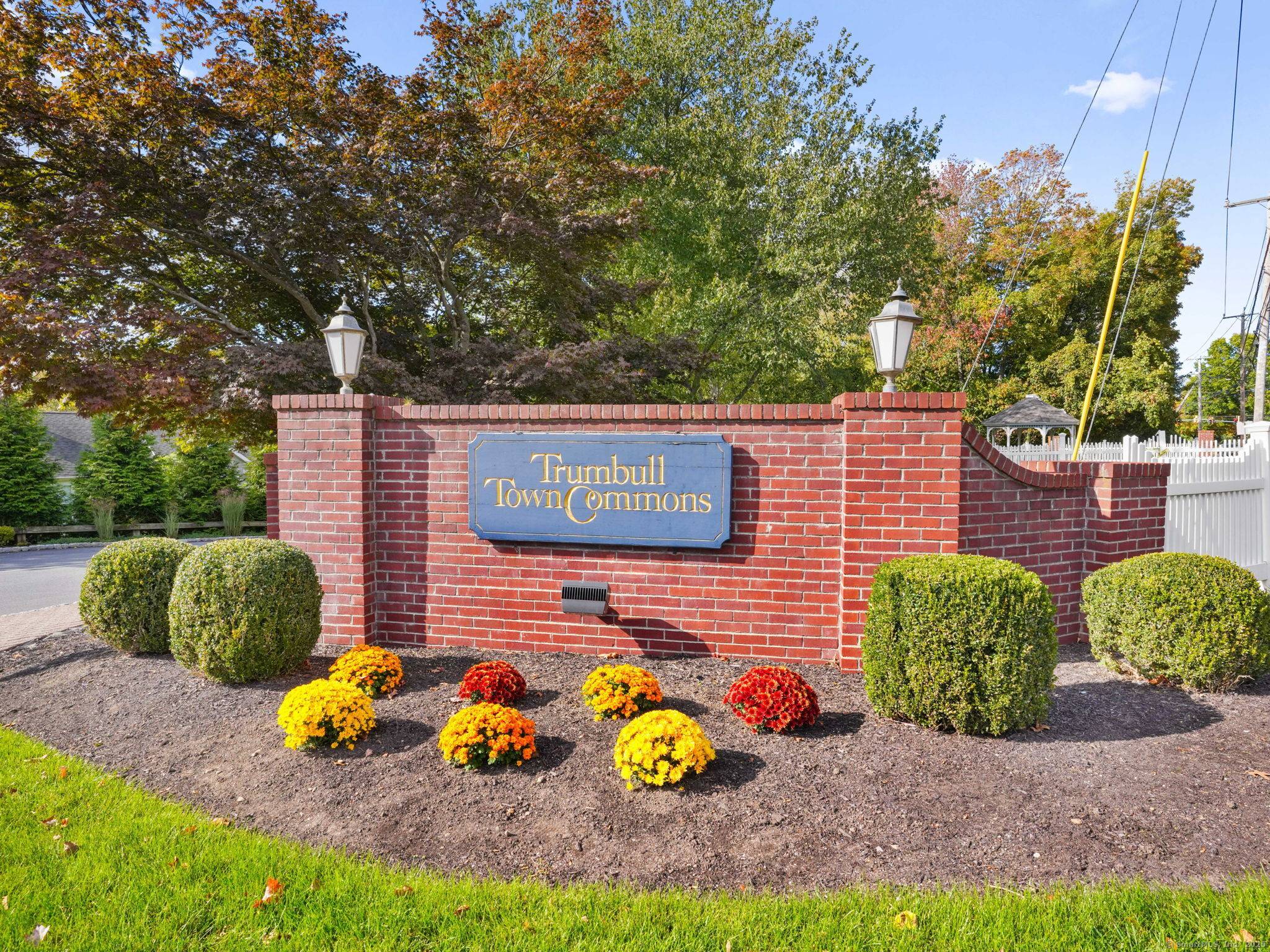 Welcome to 267 Mayfield Drive, a spacious and bright end unit in desirable Trumbull Town Commons.