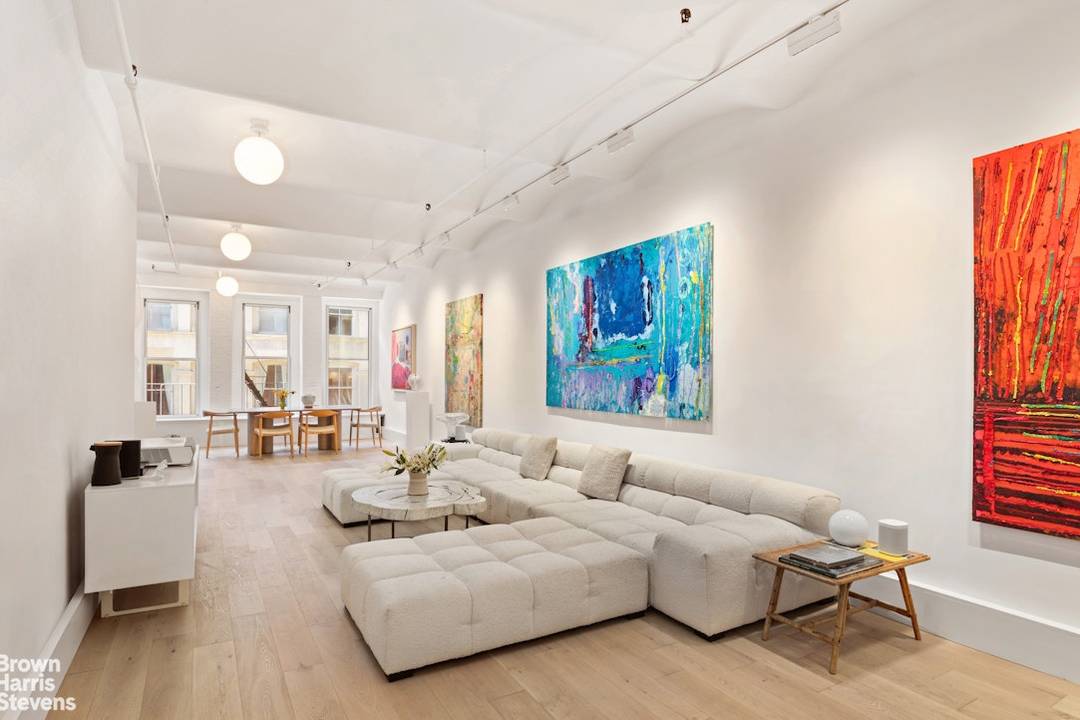 History and luxury mingle to stunning effect in this serene and meticulously renovated full floor loft located on a prime cobblestone block in Soho's iconic Cast iron District.