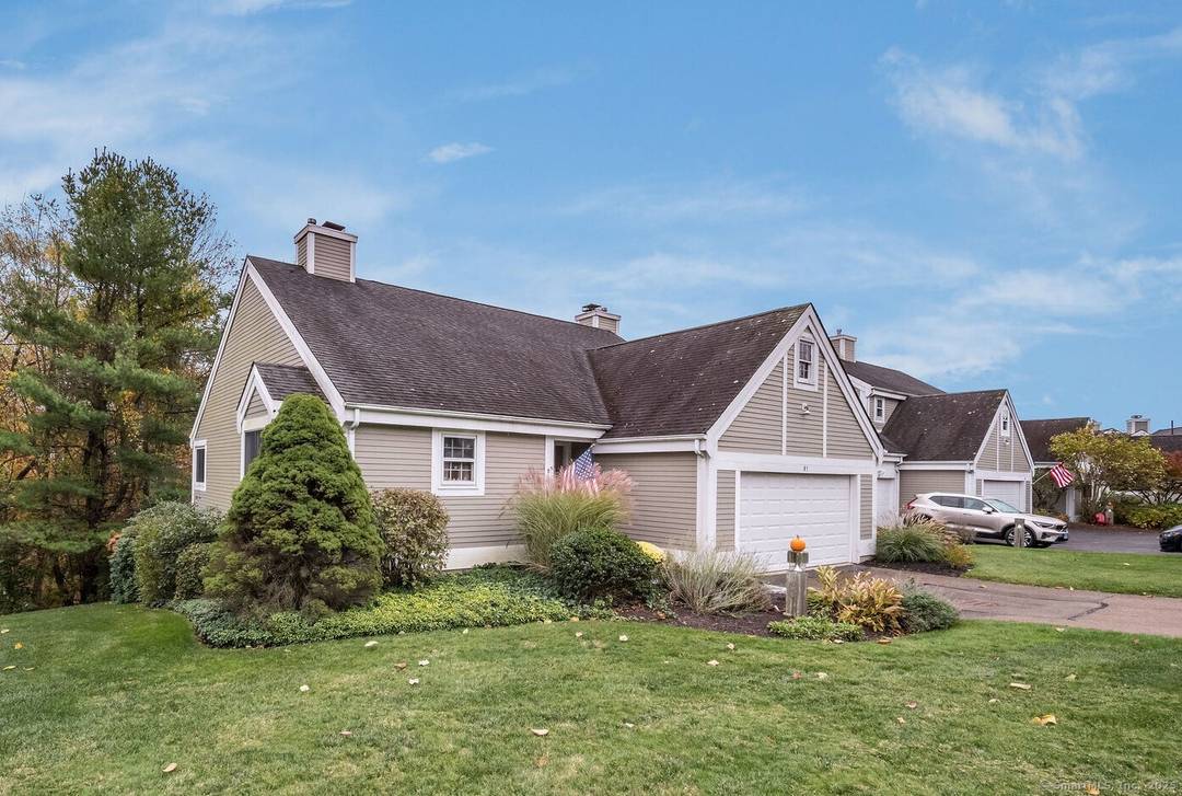 Bright and inviting end unit ranch at Legend Hill offering easy one floor living.