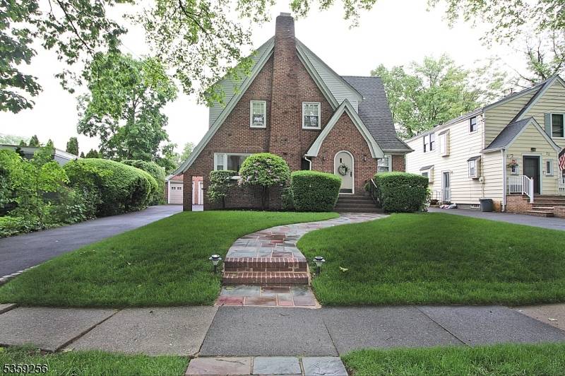 Large and rare storybook Tudor combining charm and convenience.