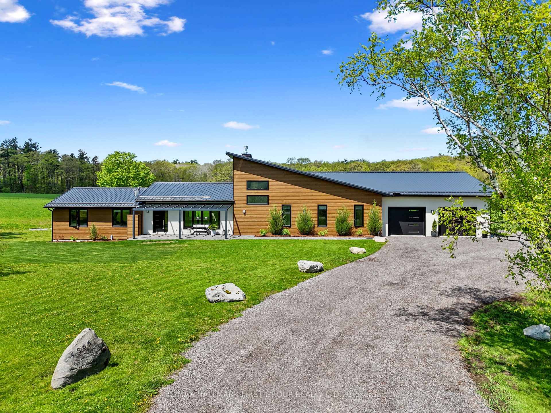 Set on a sprawling 23 acre estate, this striking modern residence exemplifies the perfect balance between contemporary elegance and rural serenity.