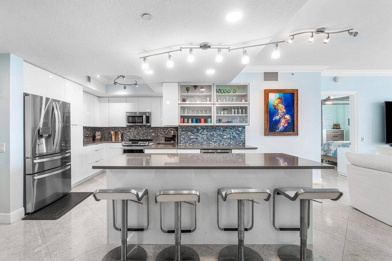 Impeccably maintained CORNER UNIT w 2BR den, 2BA overlooking the Intracoastal ocean !