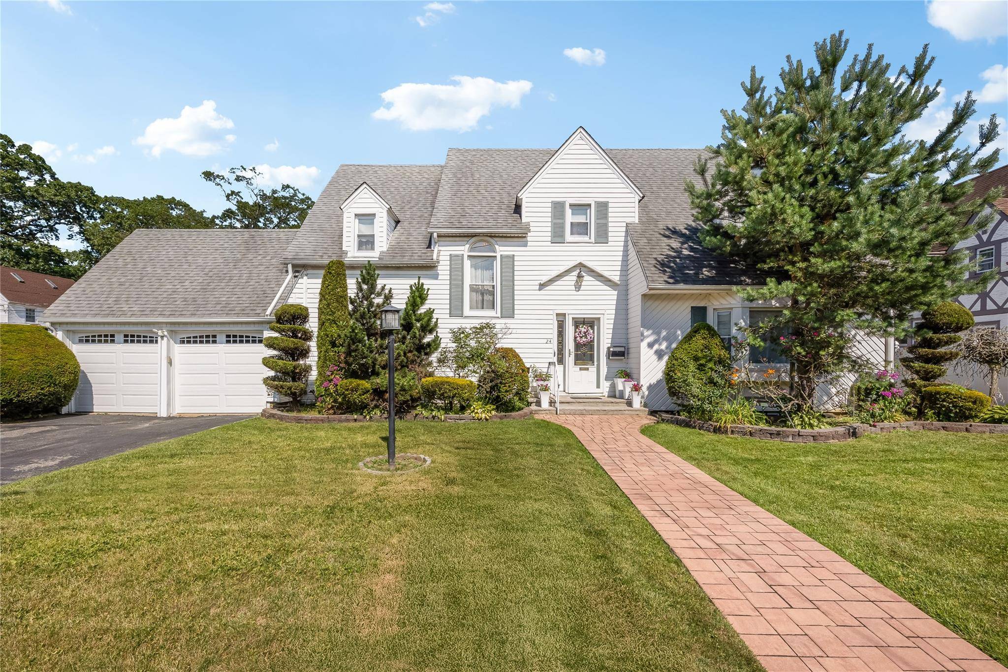 This elegant Center Hall Colonial offers timeless charm with modern amenities, making it the ideal family home !